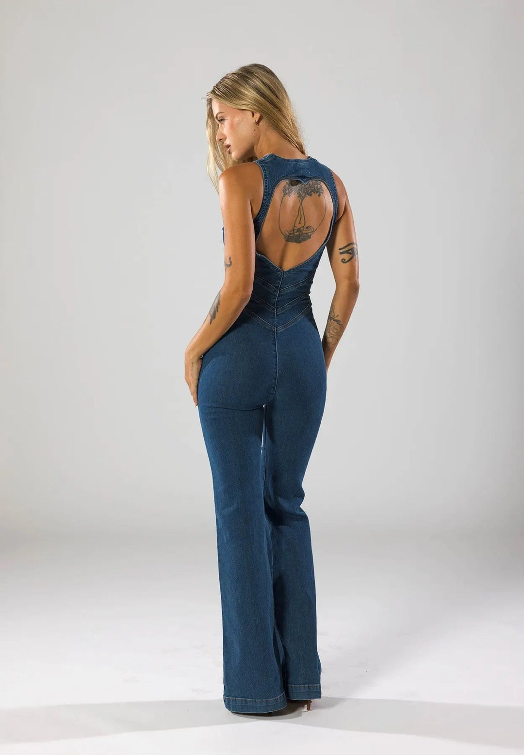 Duttini | Fitted Denim Jumpsuit with Plunge Neck and Flared Legs