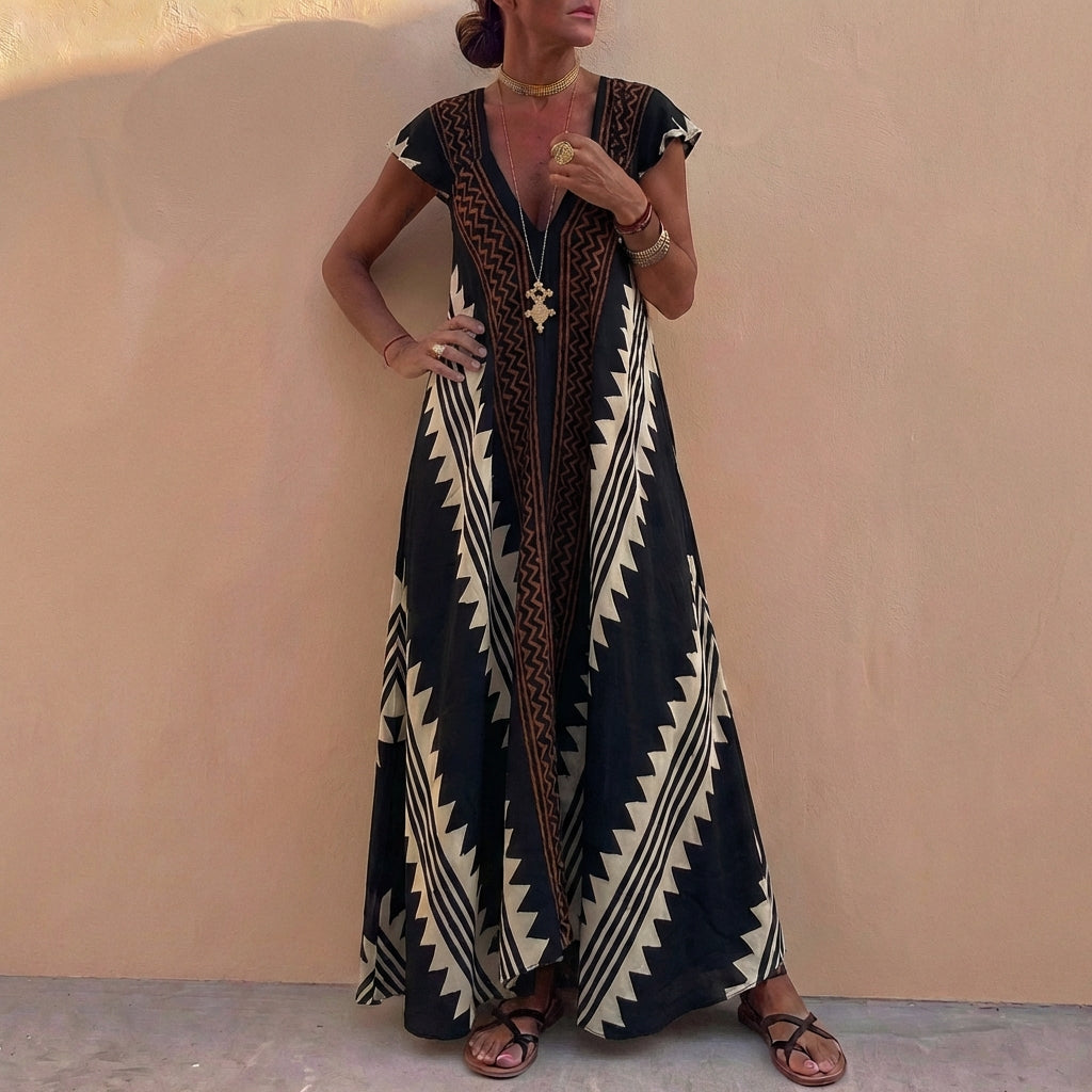 Duttini | Flowing Bohemian-Inspired Flowing A-Line Maxi Dress With Deep V-Neck And Geometric Motifs