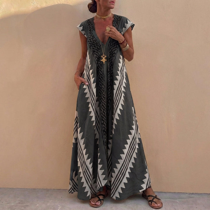 Duttini | Flowing Bohemian-Inspired Flowing A-Line Maxi Dress With Deep V-Neck And Geometric Motifs
